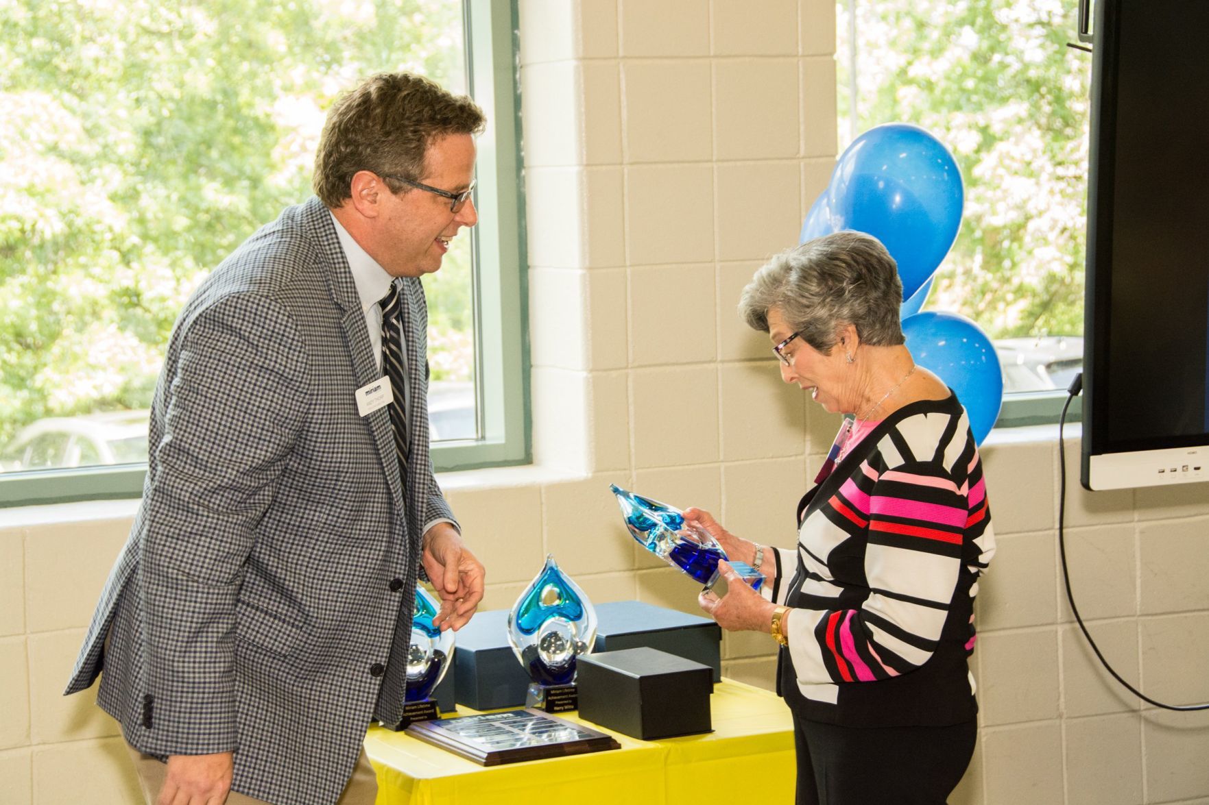 Andy Thorp, Executive Director of Miriam School presents Barbara Silver with her award at the Friends of Miriam Luncheon